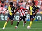 Brentford's Rico Henry in action with AFC Bournemouth's Philip Billing and Antoine Semenyo on September 2, 2023