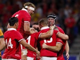 Wales' Gareth Davies celebrates scoring their first try with teammates on September 24, 2023