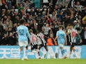 Newcastle United's Alexander Isak celebrates scoring their first goal with Anthony Gordon on September 27, 2023