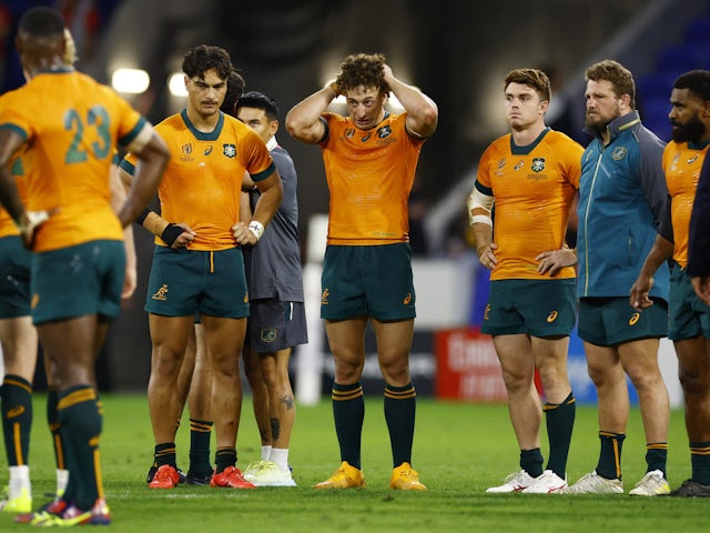 Australia's Andrew Kellaway, Mark Nawaqanitawase and Jordan Petaia look dejected after the match on September 29, 2023