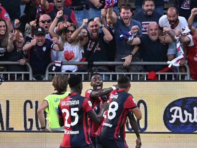 Cagliari's Zito Luvumbo celebrates scoring their first goal with teammates on September 27, 2023