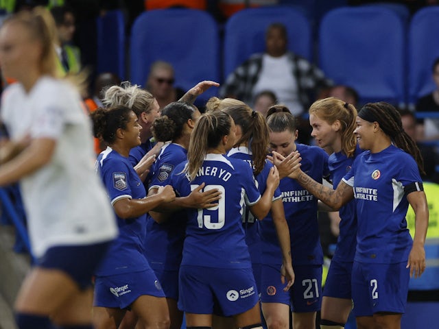Chelsea Women's Mia Fishel celebrates scoring their first goal with teammates on October 1, 2023