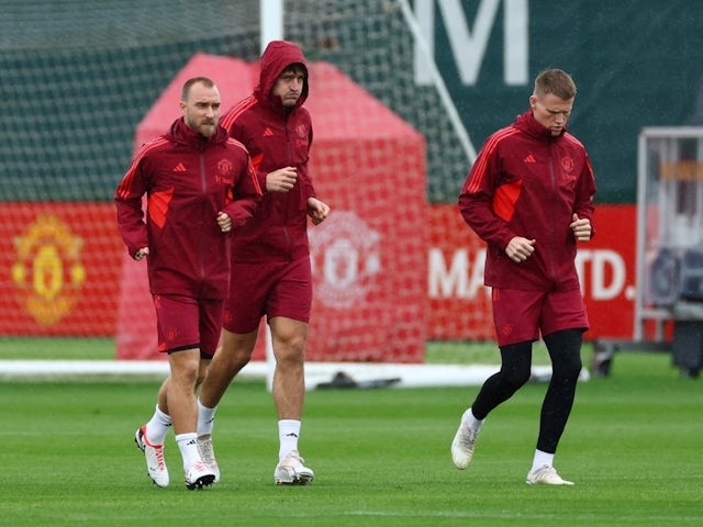 Manchester United's Christian Eriksen with Harry Maguire and Scott McTominay during training on September 19, 2023