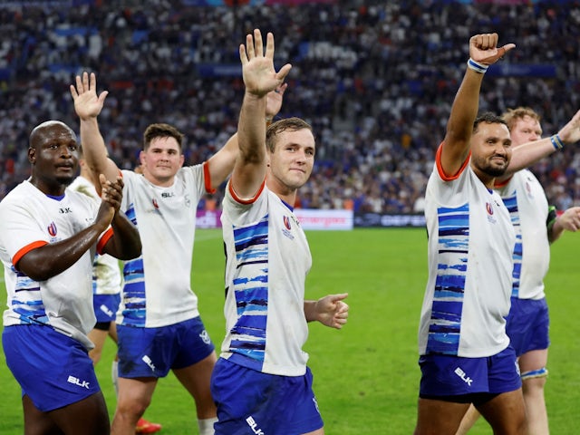 Namibia's Danco Burger and teammates acknowledge the fans after the match on September 21, 2023