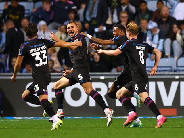 Huddersfield Town's Michal Helik celebrates scoring their first goal on September 25, 2023