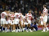 Japan players celebrate after the match on September 28, 2023