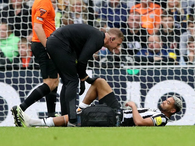 Newcastle United's Joelinton receives medical attention after sustaining an injury on September 30, 2023