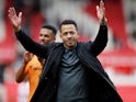 Hull City manager Liam Rosenior applauds the fans after the match on September 24, 2023