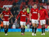 Manchester United's Harry Maguire and teammates look dejected after the match on September 30, 2023