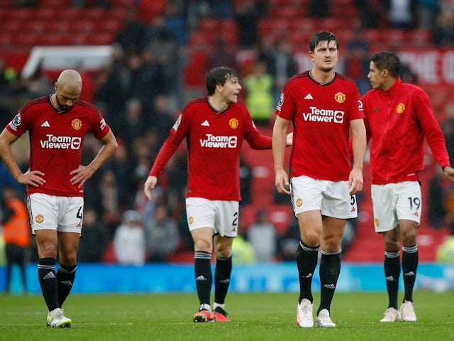 Manchester United's Harry Maguire and teammates look dejected after the match on September 30, 2023