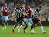 Newcastle United's Dan Burn and Bruno Guimaraes in action with Burnley's Luca Koleosho on September 30, 2023