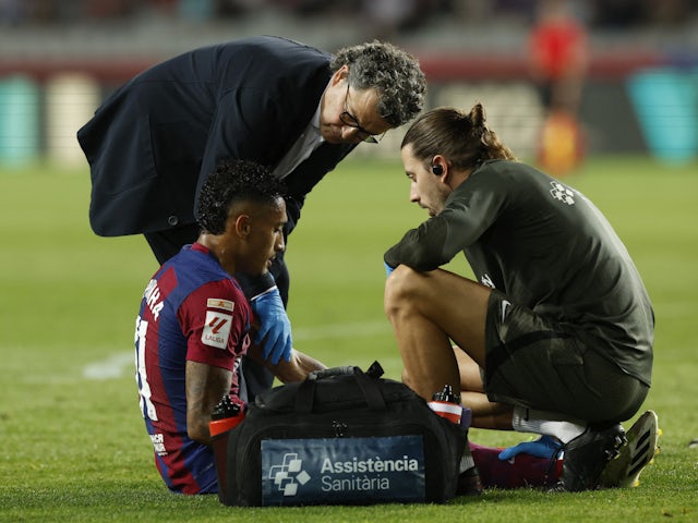 Barcelona's Raphinha receives medical attention after sustaining an injury on September 29, 2023