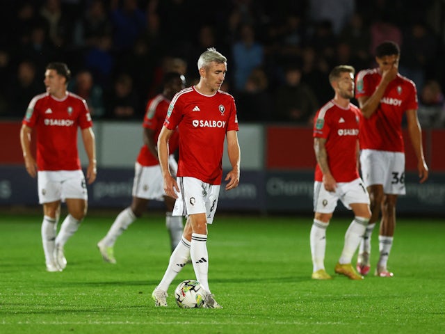 Salford City's Matty Lund looks dejected after Burnley's third goal on September 26, 2023