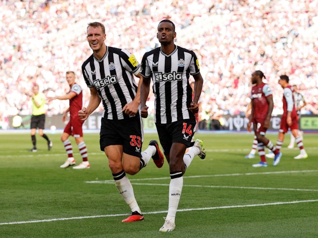 Newcastle United's Alexander Isak celebrates scoring their first goal with Dan Burn on October 8, 2023