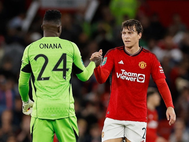Manchester United's Andre Onana and Victor Lindelof celebrate after the match on September 26, 2023