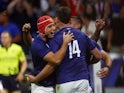France's Damian Penaud celebrates scoring their first try with Louis Bielle-Biarrey on October 6, 2023
