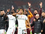 Galatasaray's Davinson Sanchez and Sacha Boey celebrate after the match on October 3, 2023
