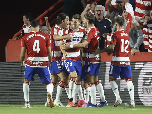 Granada's Bryan Zaragoza celebrates scoring their first goal with teammates on October 8, 2023