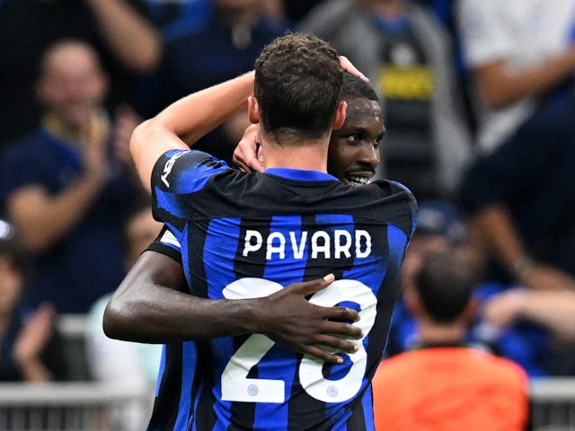 Inter Milan's Marcus Thuram celebrates scoring their first goal with teammate Benjamin Pavard on October 3, 2023