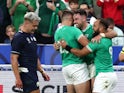 Ireland's Hugo Keenan celebrates scoring their second try with Stuart McCloskey and Jamison Gibson-Park on October 7, 2023