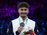 Gold medallist Britain's Jake Jarman celebrates on the podium with his medal after winning the vault exercise on October 8, 2023