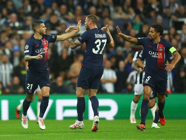 Paris St Germain's Lucas Hernandez celebrates scoring their first goal with Milan Skriniar and Marquinhos on October 4, 2023