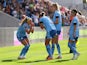 Manchester City Women's Chloe Kelly celebrates scoring their first goal with Filippa Angeldal, Esme Morgan and Yui Hasegawa on October 8, 2023