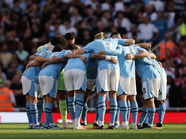 Manchester City players huddle before the match on October 8, 2023