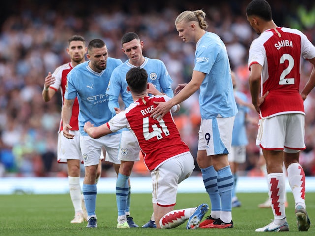 Manchester City's Mateo Kovacic, Phil Foden and Erling Braut Haaland with Arsenal's Declan Rice on October 8, 2023