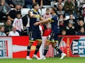 Middlesbrough's Matt Crooks celebrates scoring their second goal with teammate on October 7, 2023