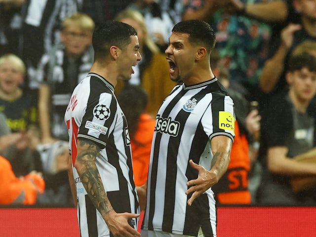 Newcastle United's Miguel Almiron celebrates scoring their first goal with Bruno Guimaraes on October 4, 2023