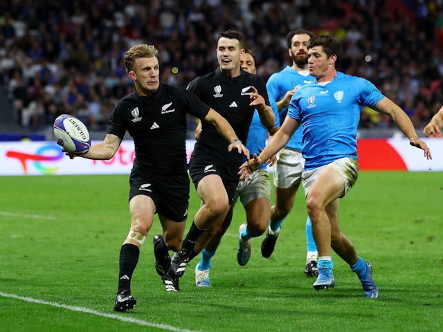 New Zealand's Damian McKenzie in action before teammate Will Jordan scores their third try on October 5, 2023