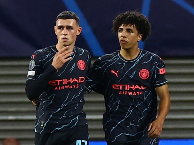 Manchester City's Phil Foden celebrates scoring their first goal with Rico Lewis on October 4, 2023