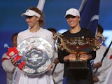 Poland's Iga Swiatek and Russia's Liudmila Samsonova pose with the trophies after the Women's Singles final match on October 8, 2023