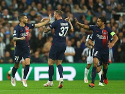 Paris Saint-Germain's (PSG's) Lucas Hernandez celebrates scoring their first goal with Milan Skriniar and Marquinhos on October 4, 2023