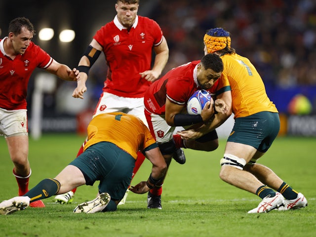 Wales' Taulupe Faletau in action with Australia's Tom Hooper on September 24, 2023