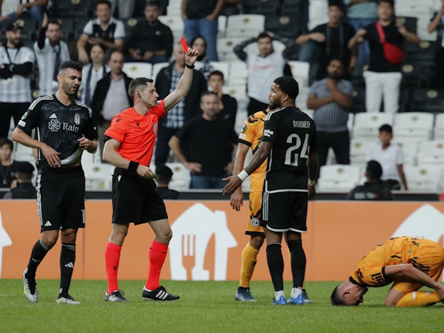 Besiktas' Valentin Rosier is shown a red card by referee David Fuxman on October 5, 2023