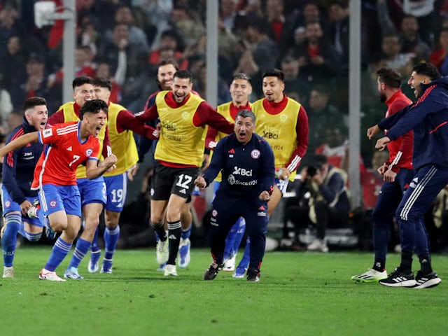 Chile's Marcelino Nunez celebrates with teammates on October 13, 2023