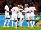 France's Kylian Mbappe celebrates scoring their second goal with teammates on October 13, 2023