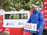 Kelvin Kiptum (KEN) celebrates after finishing in a world record time of 2:00:35 to win the Chicago Marathon on October 8, 2023