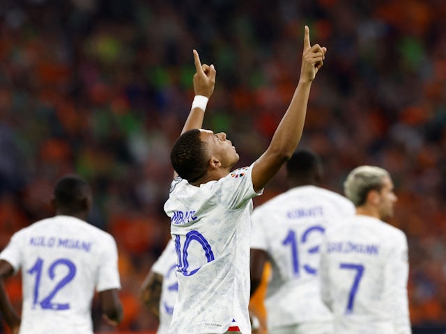 France's Kylian Mbappe celebrates scoring their first goal on October 13, 2023