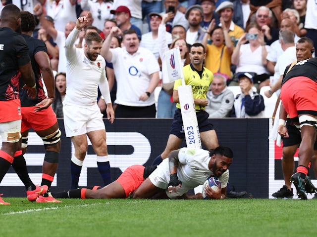 England's Manu Tuilagi scores their first try on October 15, 2023
