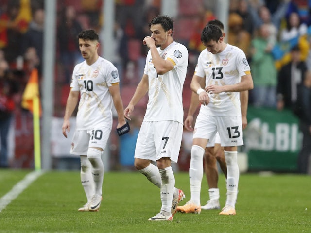 North Macedonia's Eljif Elmas, Enis Bardhi and Ljupco Doriev look dejected after the match on October 14, 2023
