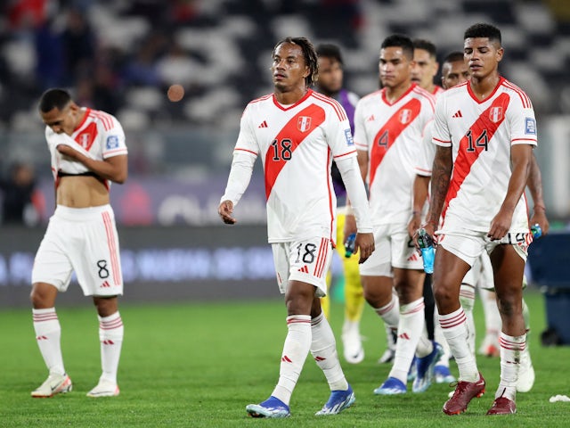 Peru's Andre Carrillo and teammates look dejected after the match on October 13, 2023