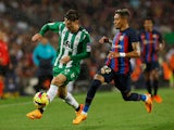 Real Betis' Juan Miranda in action with FC Barcelona's Raphinha on April 29, 2023
