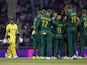South Africa celebrate taking the wicket of Australia batsman Steven Smith at the Cricket World Cup on October 12, 2023.