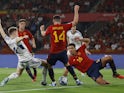 Scotland's Scott McTominay in action with Spain's Aymeric Laporte and Rodri on October 12, 2023