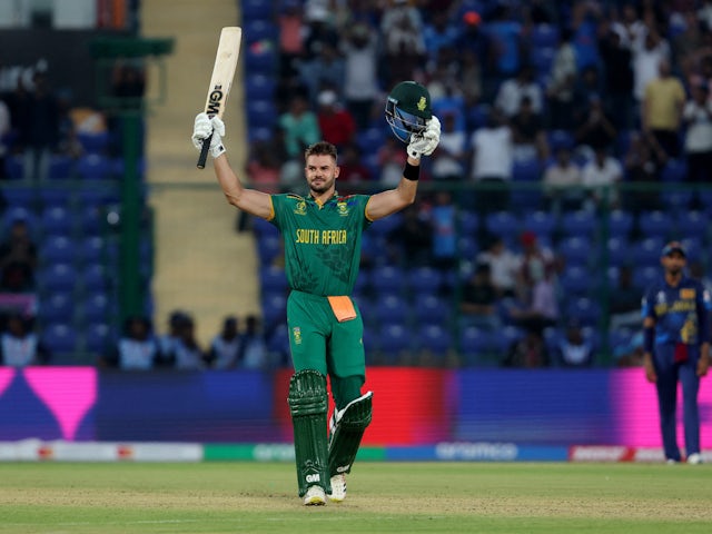 South Africa's Aiden Markram celebrates after reaching his century, the fastest ODI World Cup hundred, off just 49 balls on October 7, 2023