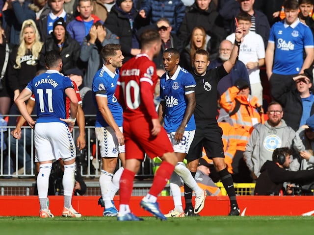 Everton's Ashley Young is shown a red card by referee Craig Pawson on October 21, 2023