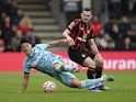 AFC Bournemouth's Lewis Cook in action with Wolverhampton Wanderers' Hwang Hee-chan on October 21, 2023